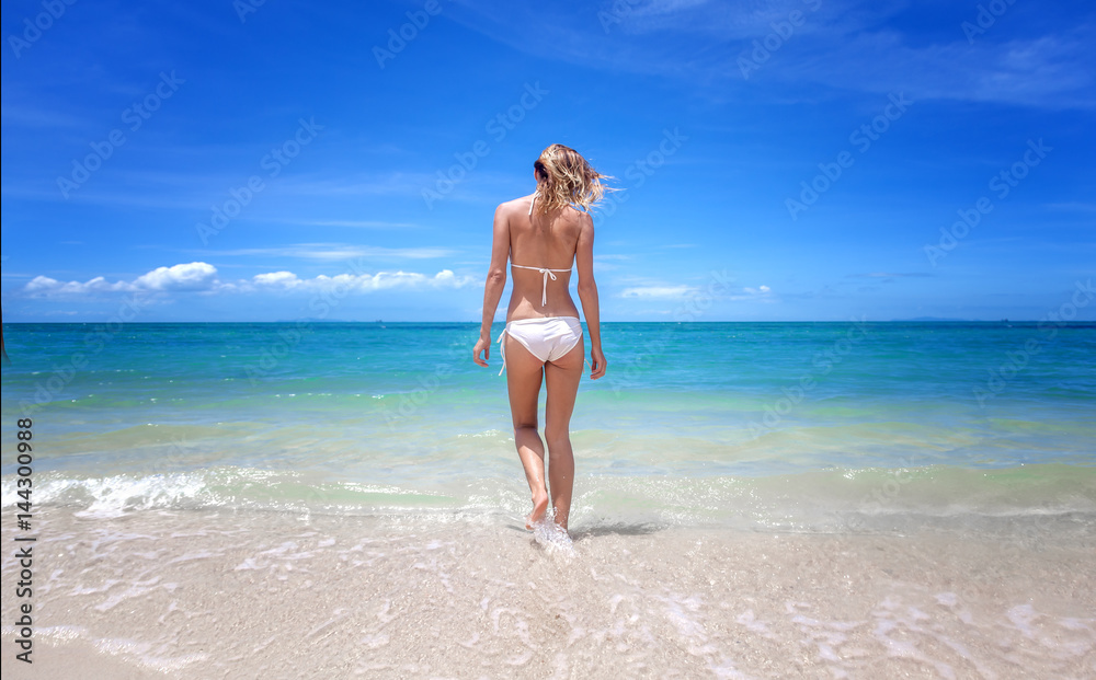 Beautiful young woman on a paradise tropical beach Beautiful young woman on a paradise tropical beach