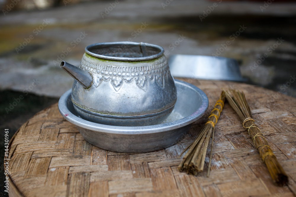 Traditional aluminum kettle for ceremonies in the temple Traditional aluminum kettle for ceremonies in the temple