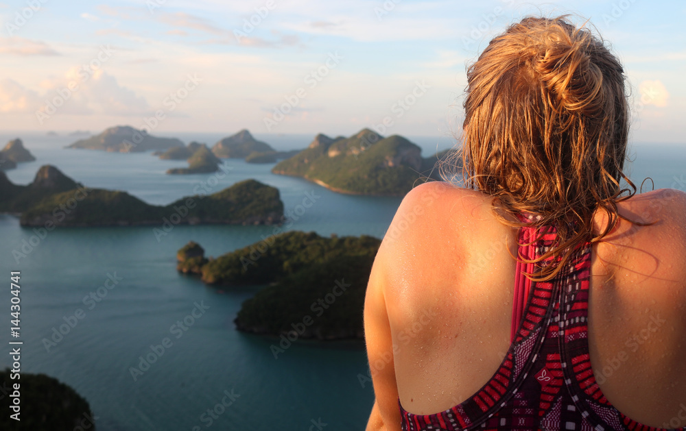 Tourists girl sweating by walking up the hill with view of ang thong archipelago island,Thailand. 