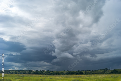 Canvas-taulu Strong storm clouds over the valley