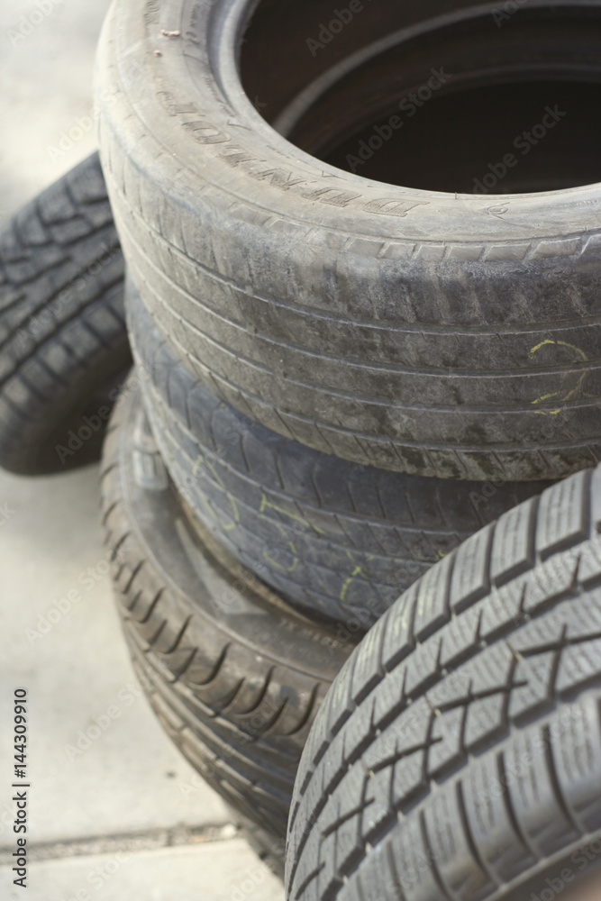 Pile of tires and wheels for rubber. Closeup for design work