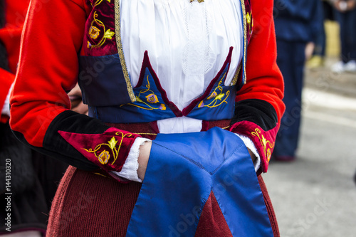 MURAVERA, ITALIA - APRILE 2, 2017:  45^ Sagra degli agrumi - dettaglio del costume tradizionale sardo del Gruppo folk di Fonni - Sardegna photo