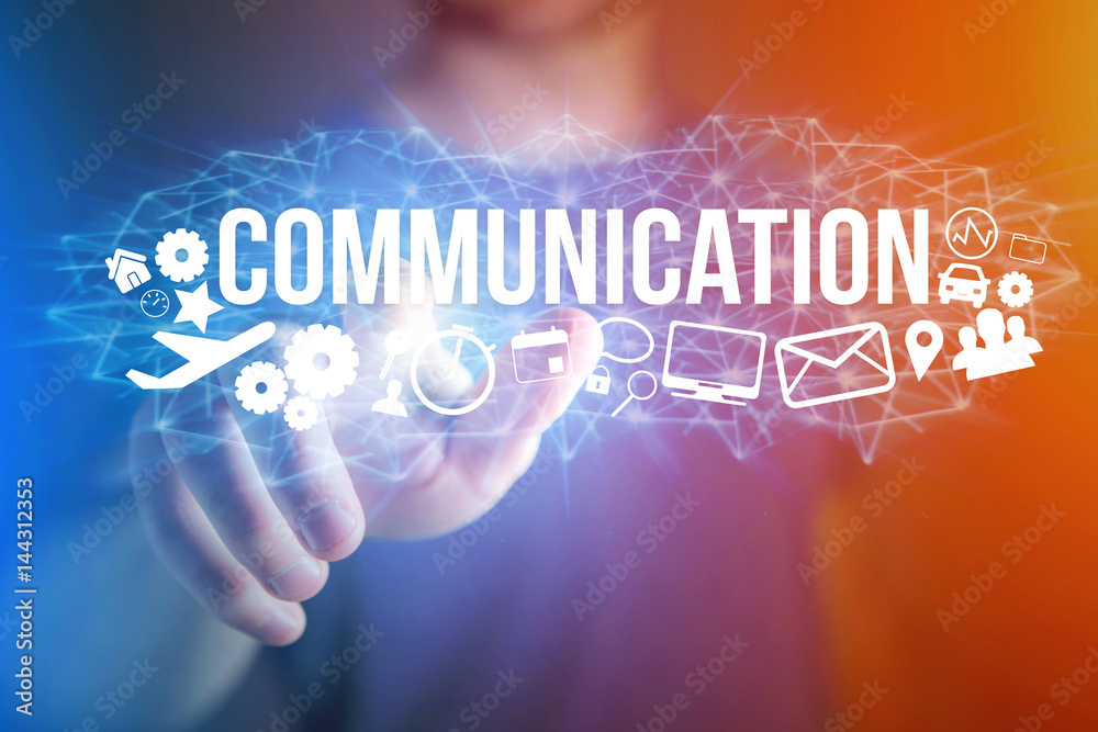 Concept of man holding a futuristic interface with communication title and multimedia icons flying all around - Internet concept Concept of man holding a futuristic interface with communication title and multimedia icons flying all around - Internet concept