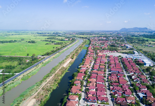 Irrigation Canal with village in countryside