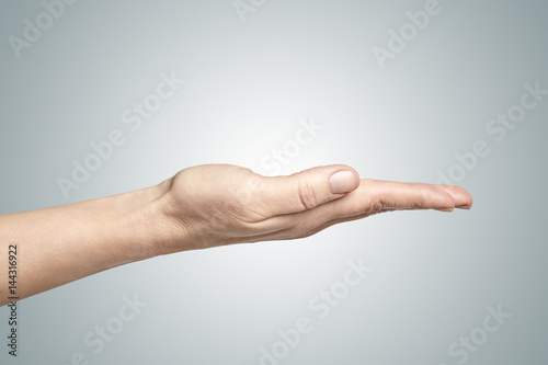 A woman hand on a gradient background