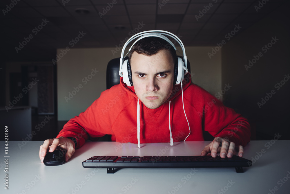 Portrait of funny gamer looking carefully monitor your computer and playing  video games. Stock Photo | Adobe Stock