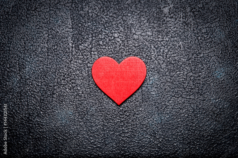 Wooden red heart on dark background. Top view Wooden red heart on dark background. Top view