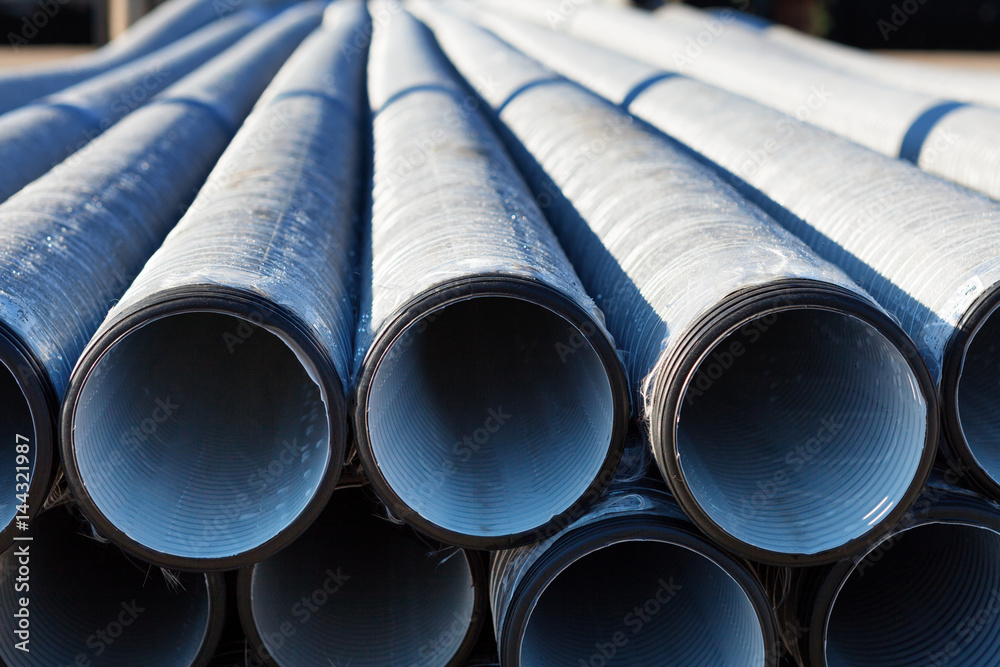 background of colorful grey plastic pipes used at the building site. background of colorful grey plastic pipes used at the building site.
