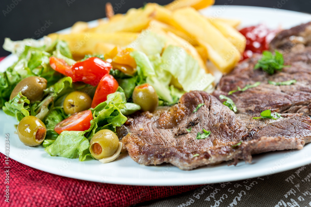 juicy steak beef meat with tomato and french fries juicy steak beef meat with tomato and french fries