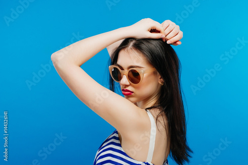 fashion model in sunglasses , beautiful young woman. Studio shot © Andriy