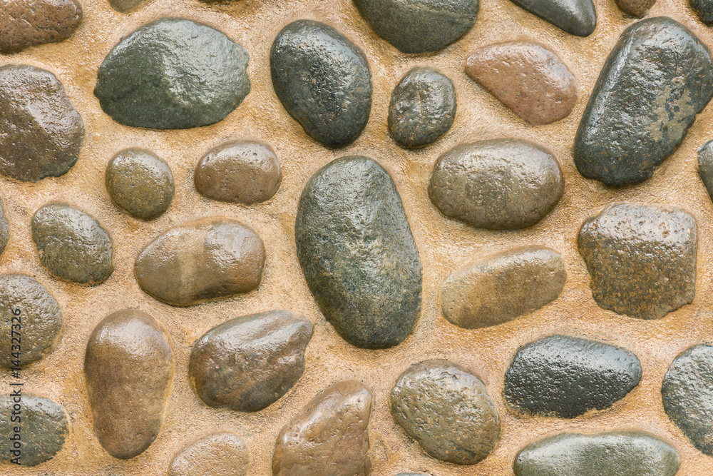 Small rocks placed in order to beautiful and fastened by cement. Use a flooring and walls, decorative home and garden. Small rocks placed in order to beautiful and fastened by cement. Use a flooring and walls, decorative home and garden.