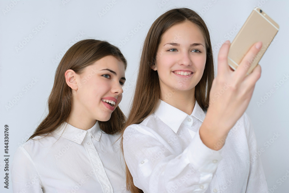 Two beautiful girls doing selfie studio, theme tourism and entertainment Two beautiful girls doing selfie studio, theme tourism and entertainment