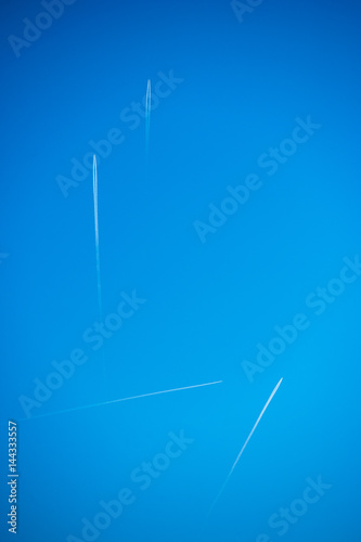 Four Airplane in blue sky in same time