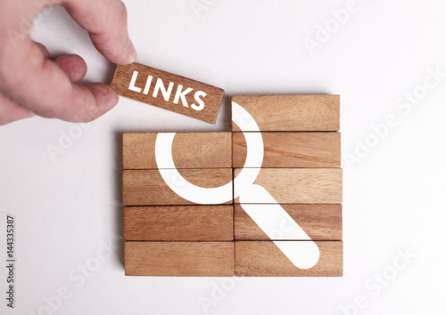 Business, Technology, Internet and network concept. Young businessman shows the word: Links photo