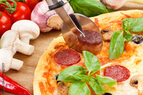 Hot pizza with cheese on a ...