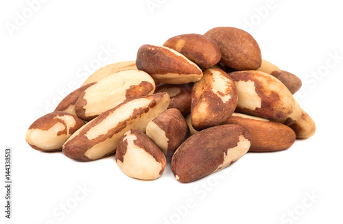 Bunch of raw Brazil nuts on white background