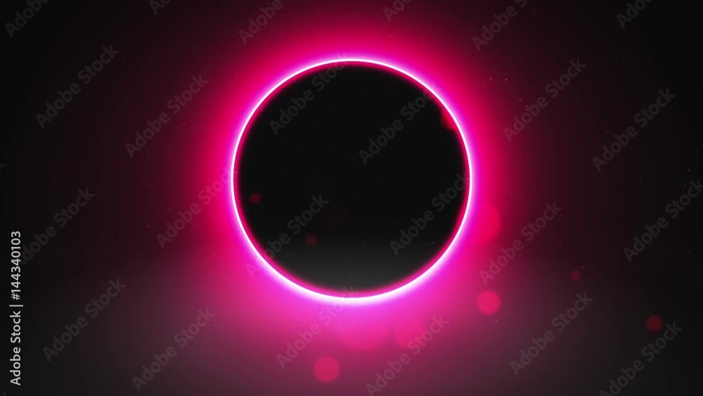 Purple neon glowing abstract ring sparkles on a black background with copy space