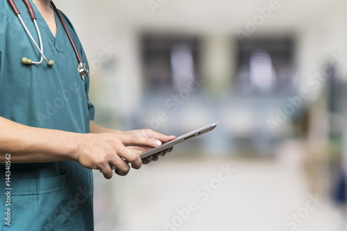 Male doctor,medical students or surgeon using digital tablet and laptop during the conference,Health Check with digital system support for patient,test results and patient registration,selective focus