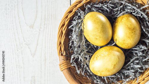 Golden eggs in a basket