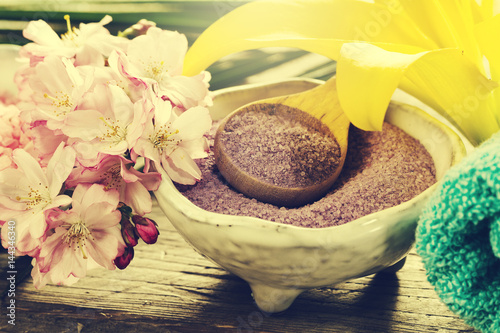 Spa Concept. Closeup of beautiful Spa Products - Spa Salt and Flowers. Horizontal.