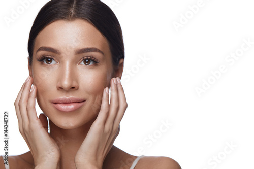 Beautiful Young Woman With Both Hands Near Face. Cosmetics