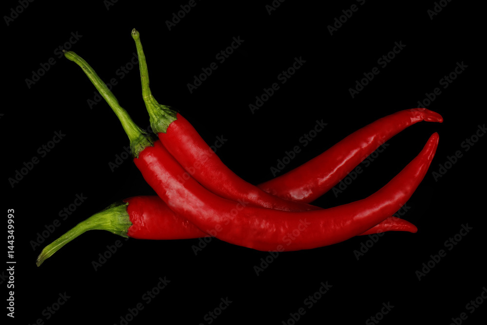 heap of red chili pepper isolated on black