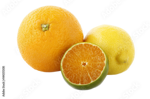 green tangerine slice and lemon isolated on white