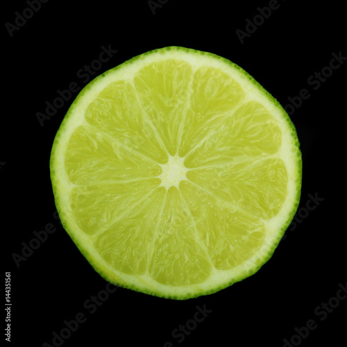 lime slice on black background isolated