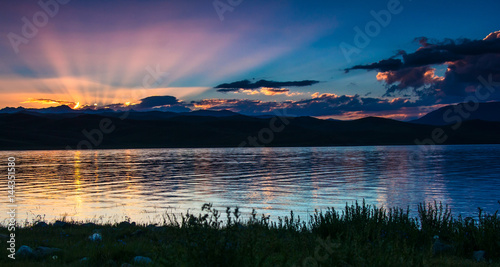 Sunset on mountain lake Son Kul. Kyrgyzstan