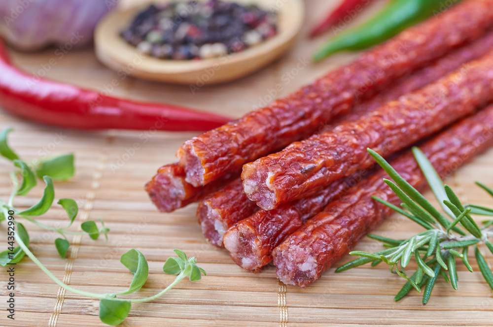 Snack stick sausage on a bamboo mat Snack stick sausage on a bamboo mat