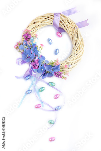 Beautiful pastel Easter Easter wreath with chocolate eggs