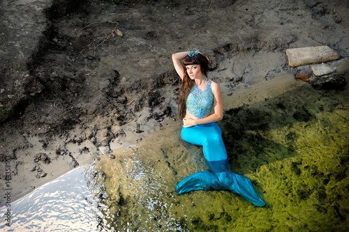 Mermaid in the water at the shore