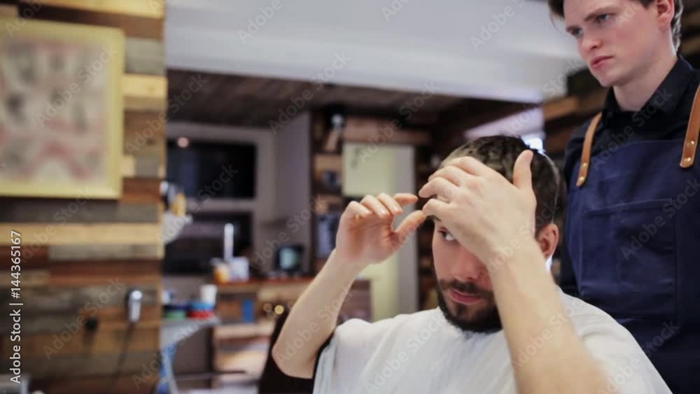man and hairstylist or hairdresser at barber shop
