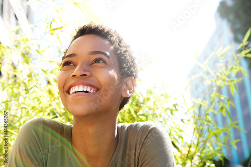 beautiful young black woman smiling outdoors
