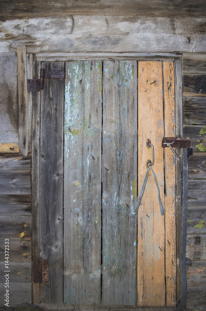 Old wooden door rusty canopies