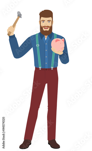 Hipster trying to break a piggy bank with a hammer