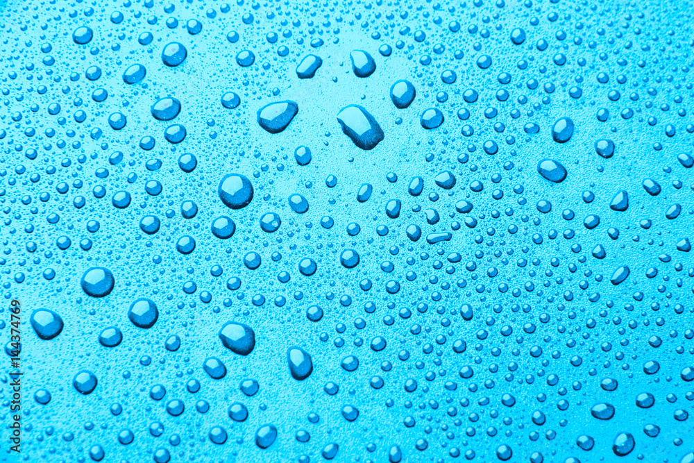 Blue drops of water on a color background.