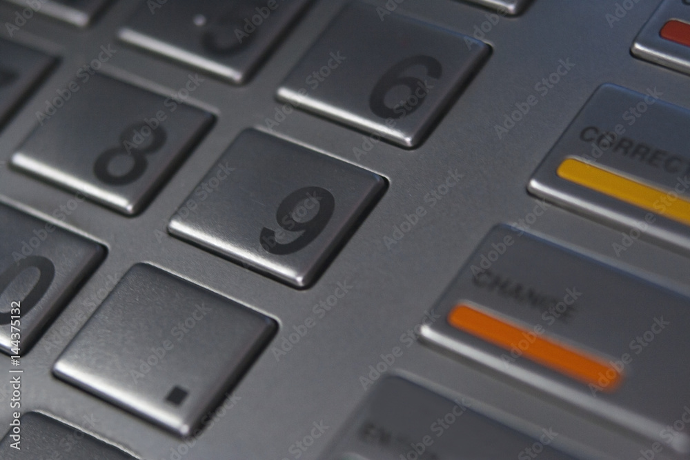 Figures on the ATM keyboard close-up. Bank and finance. Enter the PIN code Figures on the ATM keyboard close-up. Bank and finance. Enter the PIN code