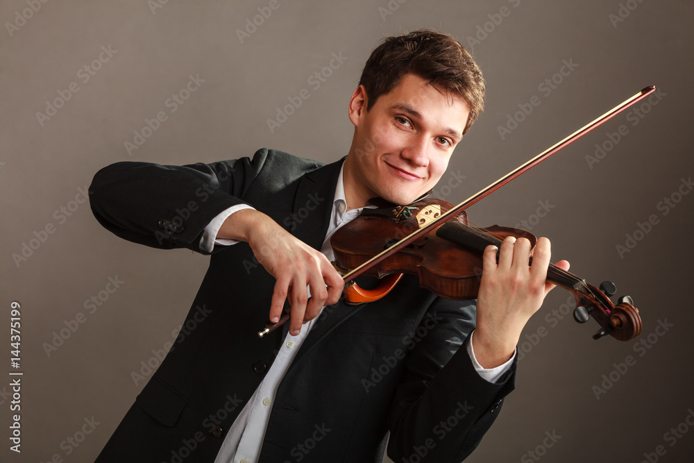 Man man dressed elegantly playing violin Man man dressed elegantly playing violin