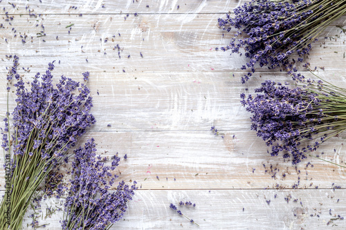 dry lavander design with bouquet on wooden background top view mockup