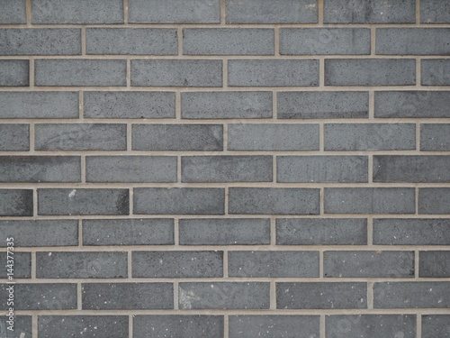 Grey brick wall staggered stacked