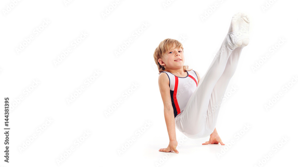 Happy little boy doing gymnastics isolated on white background Happy little boy doing gymnastics isolated on white background