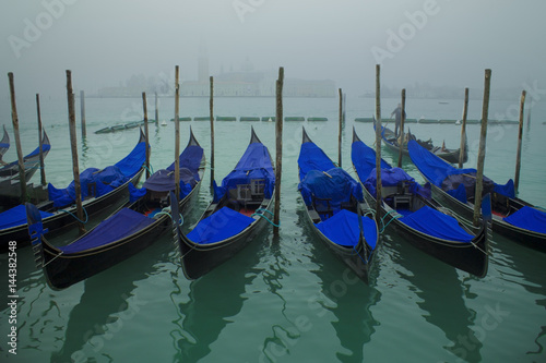 Venetian canal with gondolas,Venice,Italy