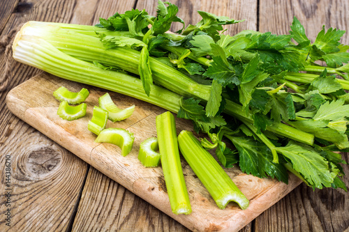 Bunch of fresh celery stalk with leaves photo