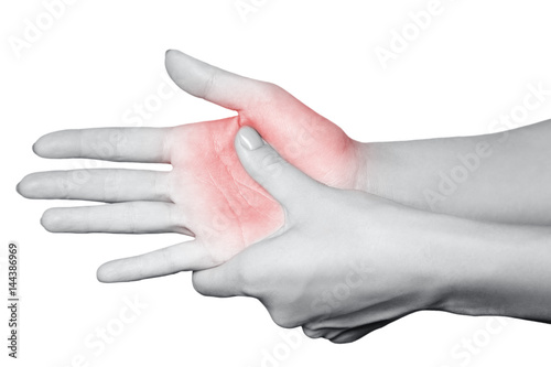 Closeup view of a young woman with pain on hand. isolated on white background. Black and white photo with red dot.