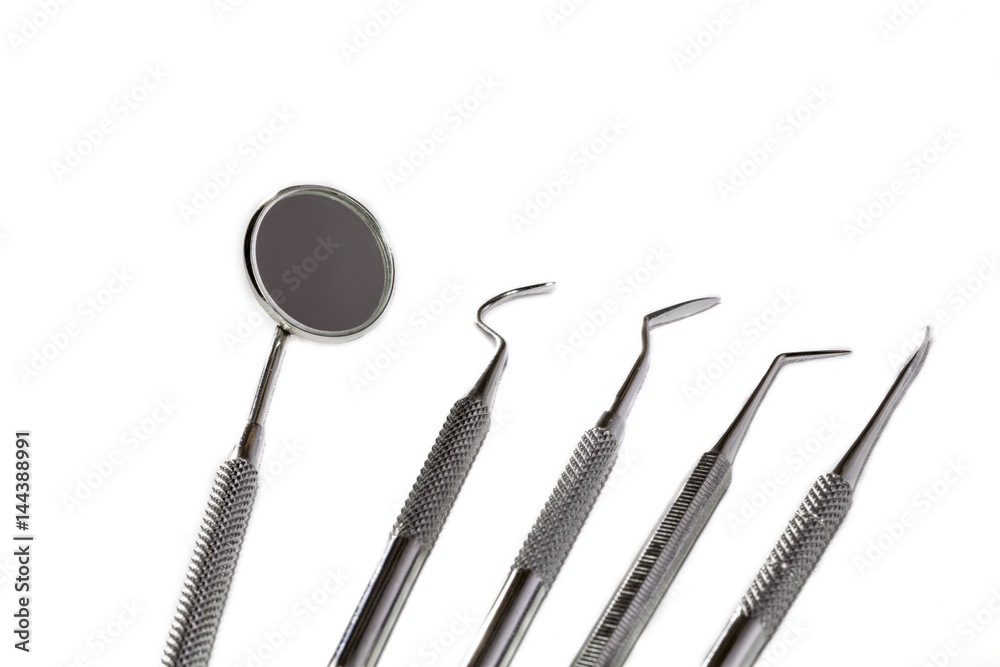 Dental instruments against white background Dental instruments against white background