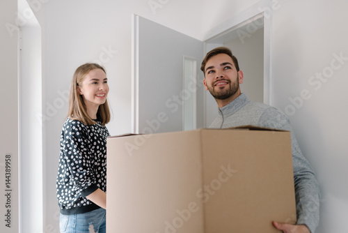 Young couple happy to be moving in together