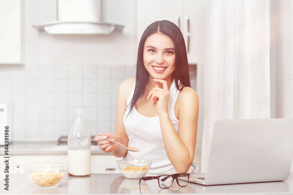 Woman smiling and holding spoon with oak flakes. Woman smiling and holding spoon with oak flakes.