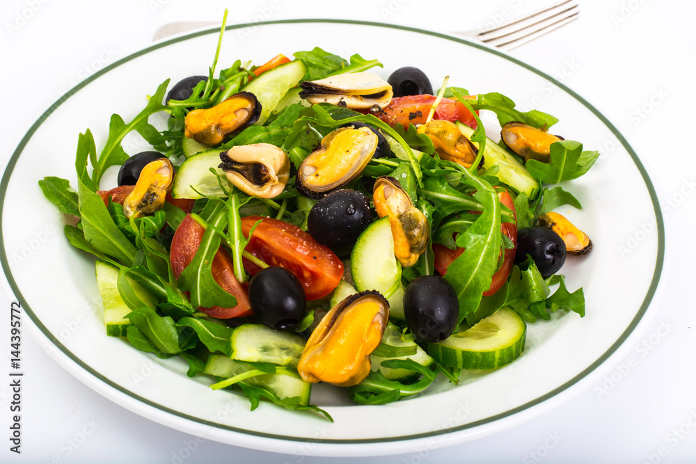 Seafood salad with mussels and arugula