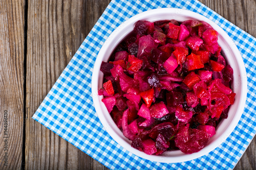 Vegetable salad with beetroot in white salad bowl Vegetable salad with beetroot in white salad bowl